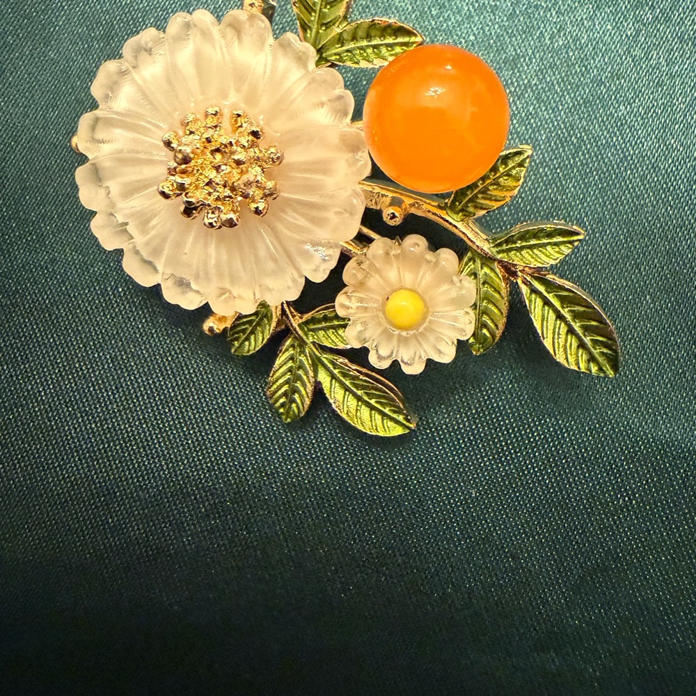 Elegant Floral Brooch with Orange and Gold Accents